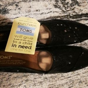 Toms black seqyins slip on